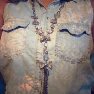 Necklace with bows and chains that dangle