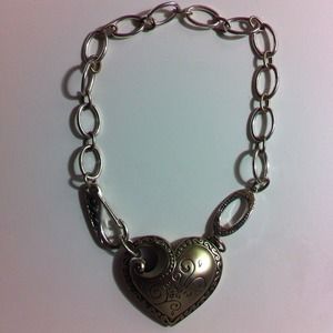 A sliver heart necklace with pretty designs