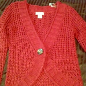 Burgundy knit sweater.