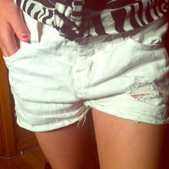 White ripped shorts.