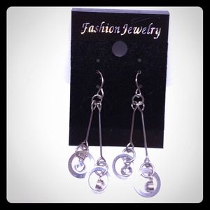 Silver circle earring.