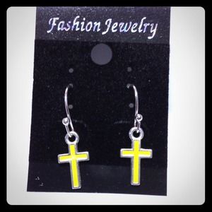 Yellow cross earring.