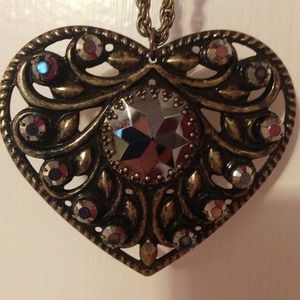 Heart pendent necklace. Antique gold color.