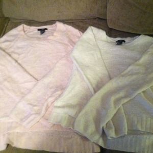 Pink and white sweaters