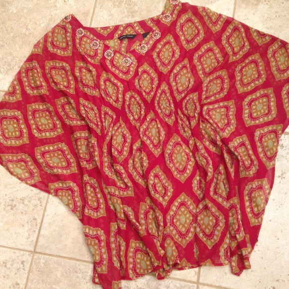 Sheer red top with accents around the neckline