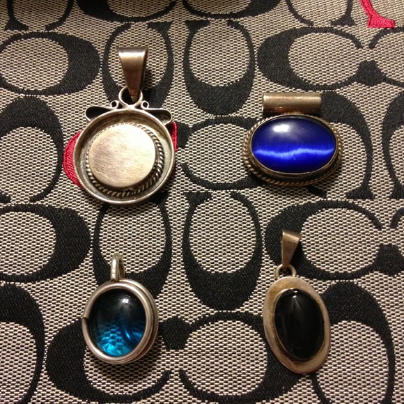 Lot of .925 sterling silver pendants.