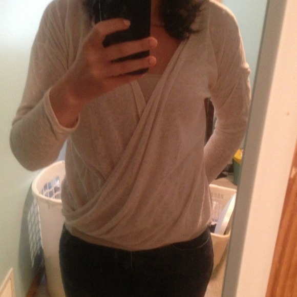 Beige shirt with sheer back.