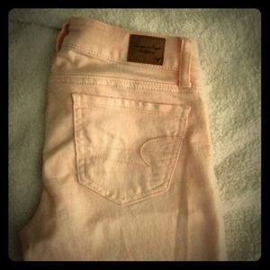 AE light salmon/pink distressed jeggings