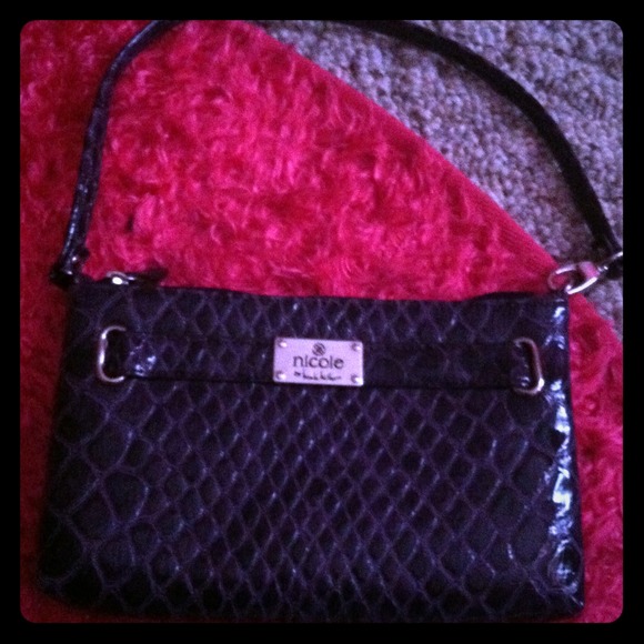 Purple Nicole handbag.