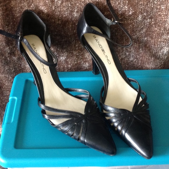 Black close toe strap heel.