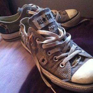 Gray Allstar chucks with patches and plaid pants
