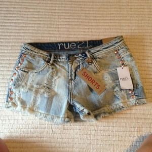 Distressed studded shorts