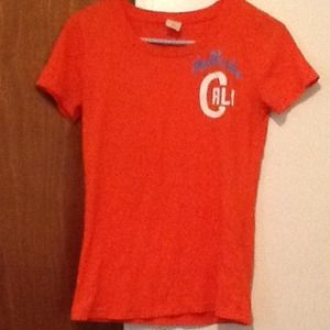 Orange Hollister t-shirt.