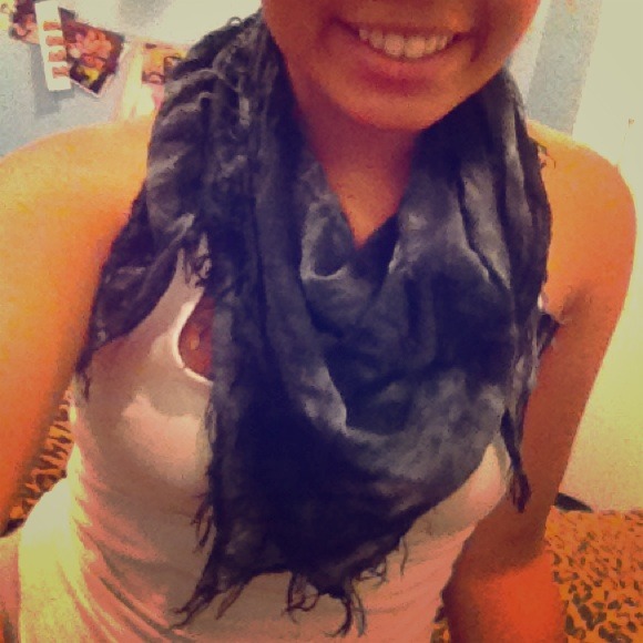 Grey scarf, with fringy bottom.