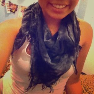 Grey scarf, with fringy bottom.