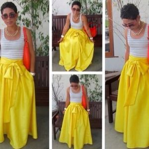 Yellow Maxi skirt with pockets and bow.