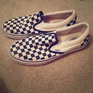 Checkered black and white slide on vans