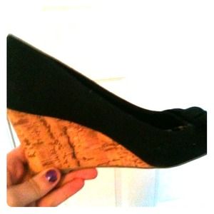 Wedges with black bow top and sandy-colored bottom