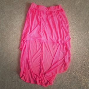 Neon pink high low skirt.