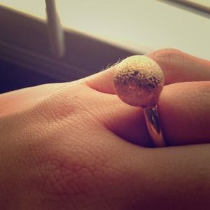 Gold ring with circle charm