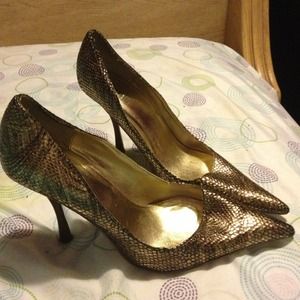 snake printed leather pumps