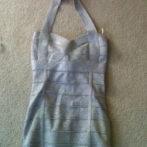 Short, halter, tight fitting silver sparkly dress!