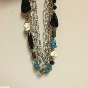 Layered chain and rock necklace.