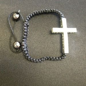 White stone cross bracelet.