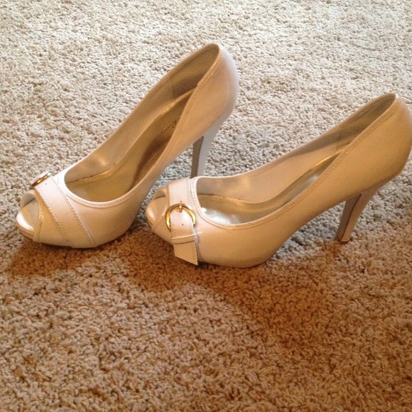 White paten leather heels with gold buckle