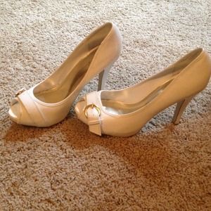 White paten leather heels with gold buckle