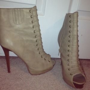 Tan high stiletto booties with lace-up detail