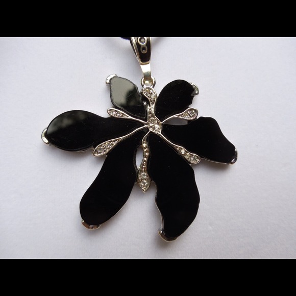 Black flower necklace.