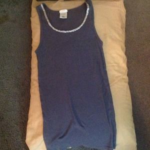 Grey tank top with rhinestones outlining the neck.