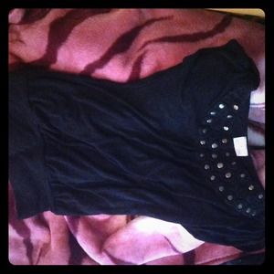 Black top with design around the neck.