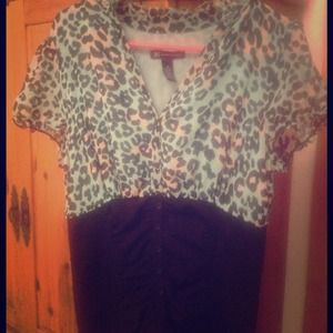 INC green and black animal print top.