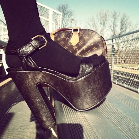 Black faux leather wedges