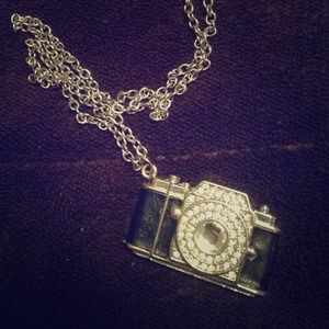 A black camera necklace
