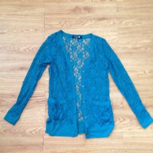 A teal, all-over lace cardigan