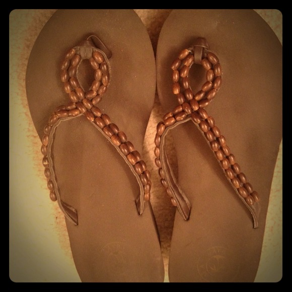 Brown wedge flip flops with beads