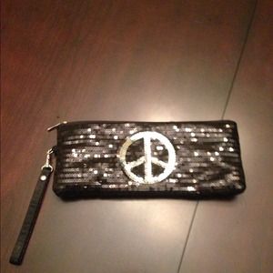 Black sequence peace wristlet