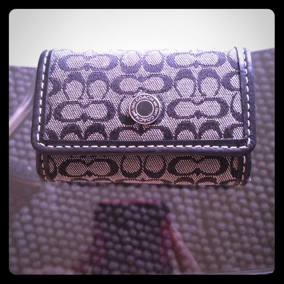Coach contact lenses case.