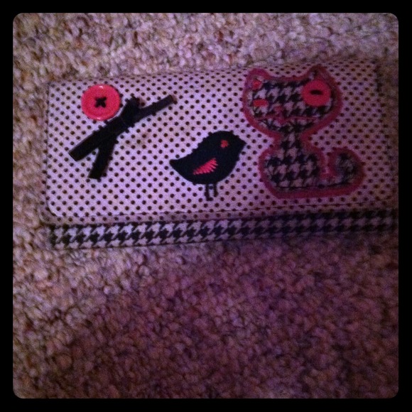 Black, white, and pink wallet.
