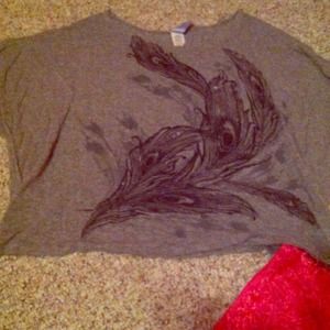 Grey shirt with feather design.