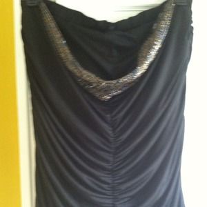 Jeweled and ruched, strapless top.  Dark blue.