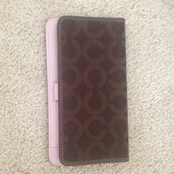 Brown and pink coach checkbook cover