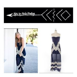 Judith March, navy, strapless maxi.