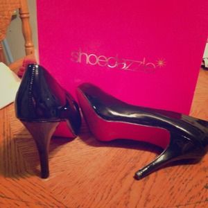 Black heels with hot pink bottoms!