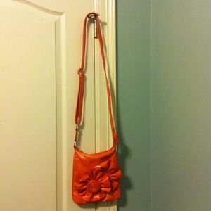 Orange over the shoulder purse with floral front