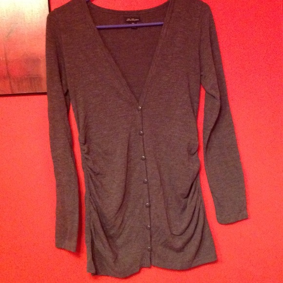Gray long sleeve button down shirt.