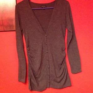 Gray long sleeve button down shirt.
